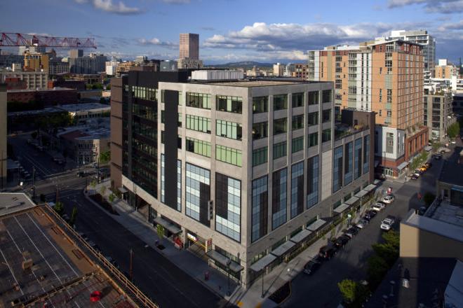 洛夫乔伊的 consists of three floors of Class A office and retail atop garage parking.